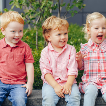 three kids smiling